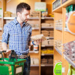 Product Development Teams Cleaning Up Labels in 2017: Report Product development teams are prioritizing clean labels in 2017 - Clean Label - Man in supermarket looking at product label