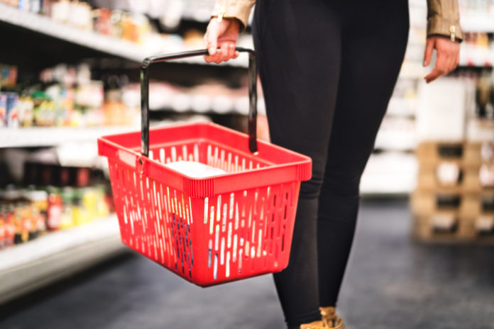 Woman holding shopping basket