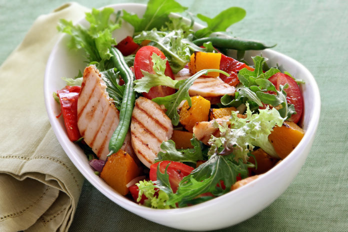 Chicken salad with roasted vegetables and mixed greens