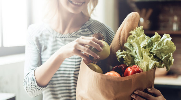 IFIC Survey: Standout Trends Include Plant-Based Eating, Sustainability, and More woman shopping for groceries