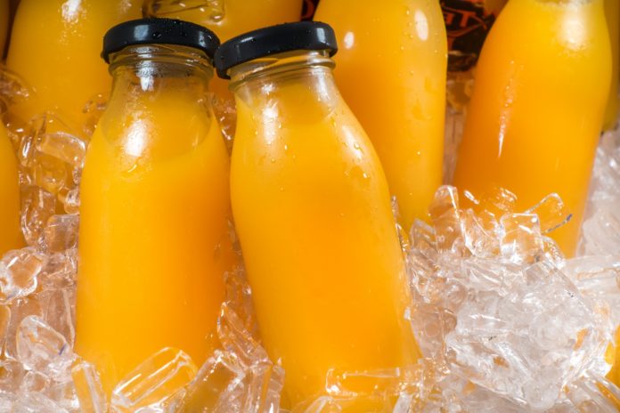 Better Juice is scaling up, Packed bottles with yellow juice