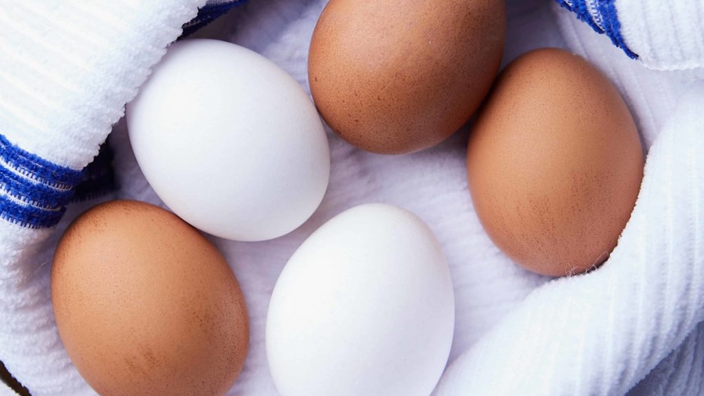 Two white and three Brown Eggs