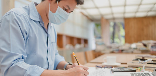 man using calculator