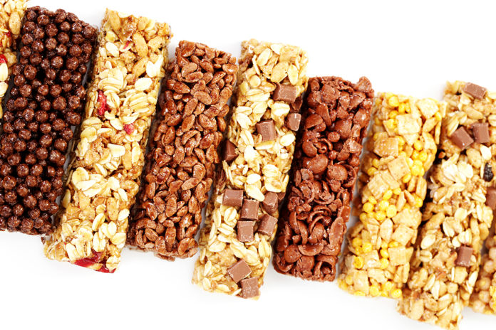 granola bars on white background - diet and breakfast