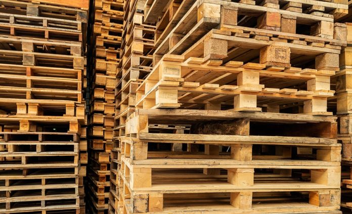 Stack Of Wooden Pallet. Industrial Wood Pallet At Factory Wareho
