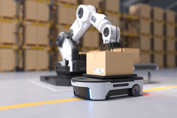 The Robot Arm Picks Up The Box To Autonomous Robot Transportatio