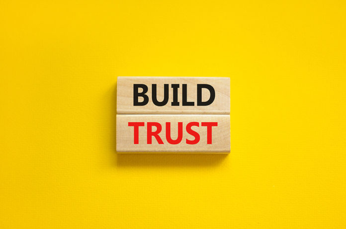 Build Trust Symbol. Concept Words Build Trust On Wooden Blocks O