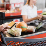 Food Prices Rise 1.2% in May: CPI Report Cropped View Of Man Holding Credit Card Near Shopping Cart And S
