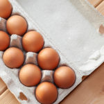 USDA Predicts Food-at-Home Prices Will Increase 10 to 11% in 2022 A Few Brown Eggs Among The Cells Of A Large Cardboard Bag, A Chi