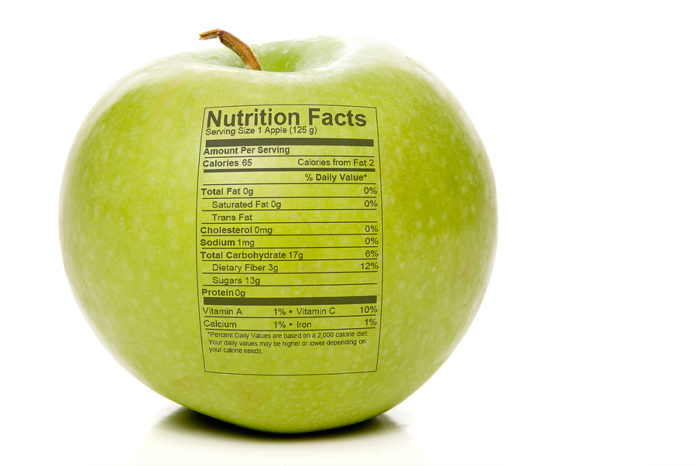 The nutrition facts stamped on an apple.
