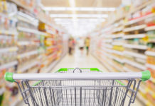 24% of Food and Beverage Dollars Now Go to Private Label. Which of Your SKUs Will Survive? Supermarket Aisle With Empty Shopping Cart At Grocery Store Reta