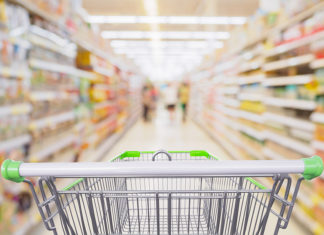 24% of Food and Beverage Dollars Now Go to Private Label. Which of Your SKUs Will Survive? Supermarket Aisle With Empty Shopping Cart At Grocery Store Reta