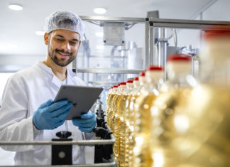 Welcome to the New Era of Smart Manufacturing, Where Workers Are Empowered to Work Alongside Automation Technologist Holding Tablet Computer And Checking Production Of