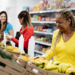 Rise in Food Prices Continue to Slow in November With 0.5% Increase: CPI Report Senior African Woman Buying Fresh Fruits In Supermarket