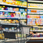 Food Price Increases Slow in February: CPI Report A shopping cart by a store shelf in a supermarket