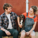 Despite Inflation, Pet Owners Still Purchase Premium Pet Products Couple with a rescued pit bull terrier dog