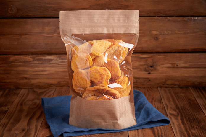 Organic Dried Fruit - Dried Peach In Craft Eco Packaging On A Te