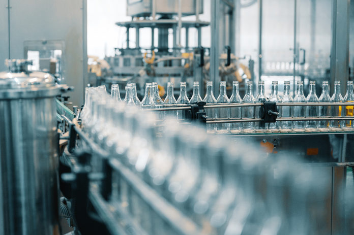 Production Line Transports Empty Glass Bottles For Alcohol Drink