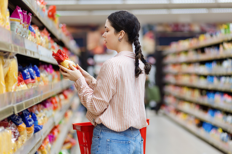 woman choosing products in grocery store