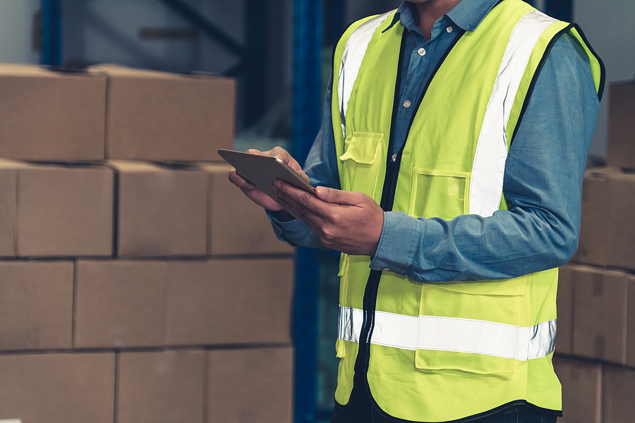 Asian Warehouse Worker Checking Packages In Storehouse . Logisti