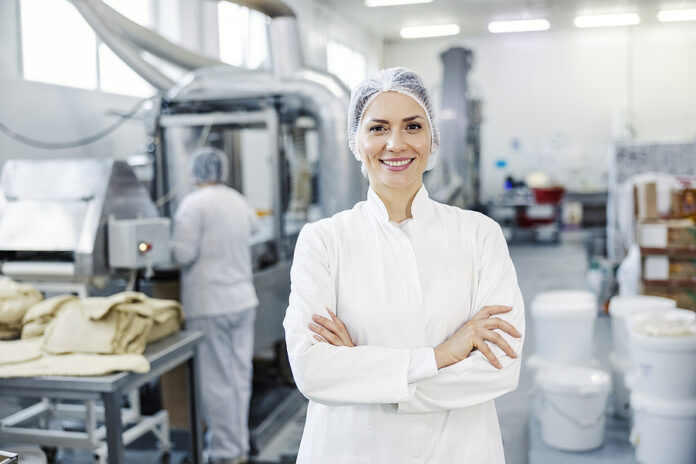 Portrait Of A Successful Female Food Plant Supervisor Smiling At