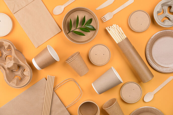 Eco-friendly Tableware - Kraft Paper Food Packaging Over Orange