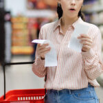 Food Prices Continue to Climb in August: CPI Report Web Banner Of Shopping And High Price. Amazement Caucasian Woman