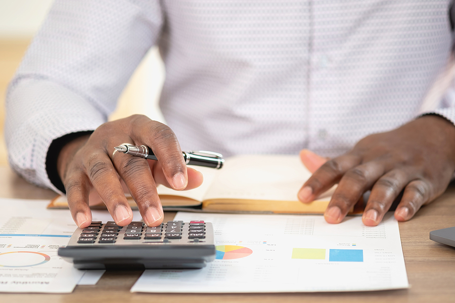 African Black Businessman Sitting Doing A Financial Report And S