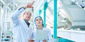 Building a Resilient F&B Workforce in 2026: Strategic Perspectives from NC Workforce Leaders John Loyack and Chris Reedy Portrait Of Senior Factory Worker Wearing Lab Coat Explaining Ru