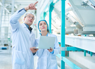 Building a Resilient F&B Workforce in 2026: Strategic Perspectives from NC Workforce Leaders John Loyack and Chris Reedy Portrait Of Senior Factory Worker Wearing Lab Coat Explaining Ru