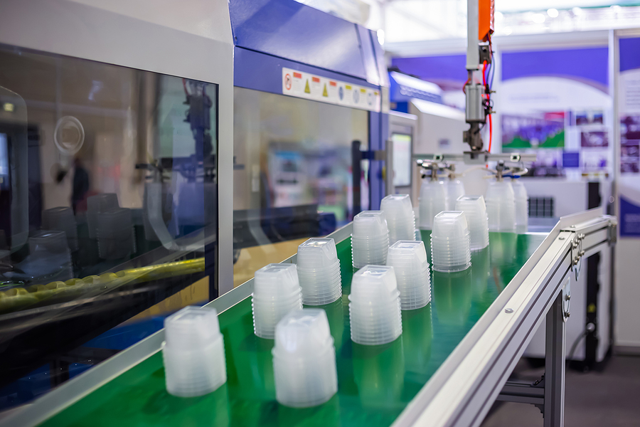 Stack Of Polypropylene Food Containers On Conveyor Belt Of Autom