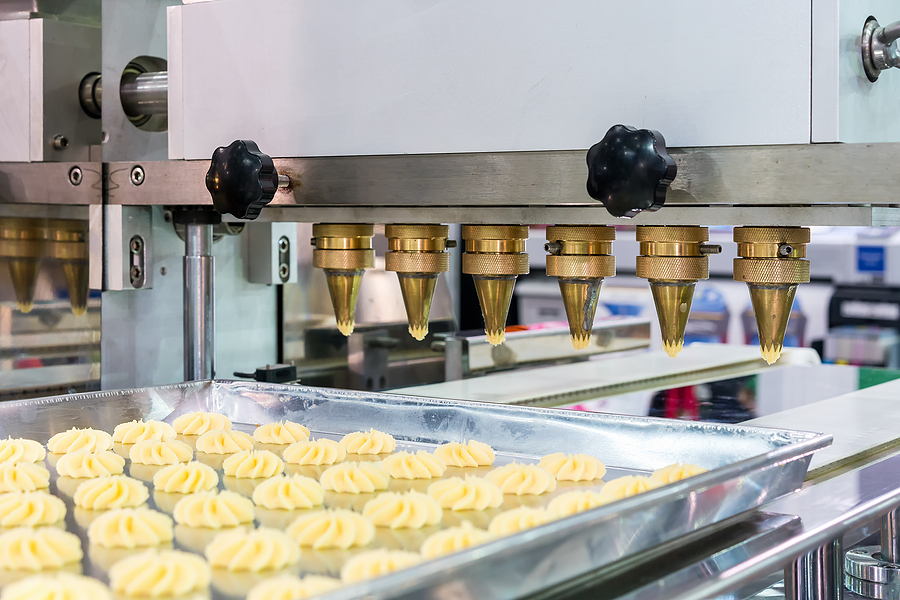 Close Up Dough Or Cream And Nozzle Discharge Of Automatic Biscui