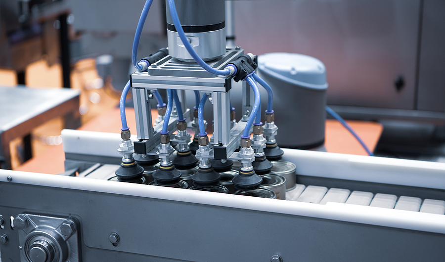 Automated Robot Arm Lifting Food Can To Conveyor Belt In Food In