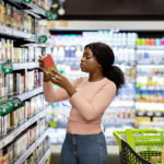 Food Prices Rise 0.2% in December: CPI Report Pretty African American Woman Choosing Groceries At Supermarket,